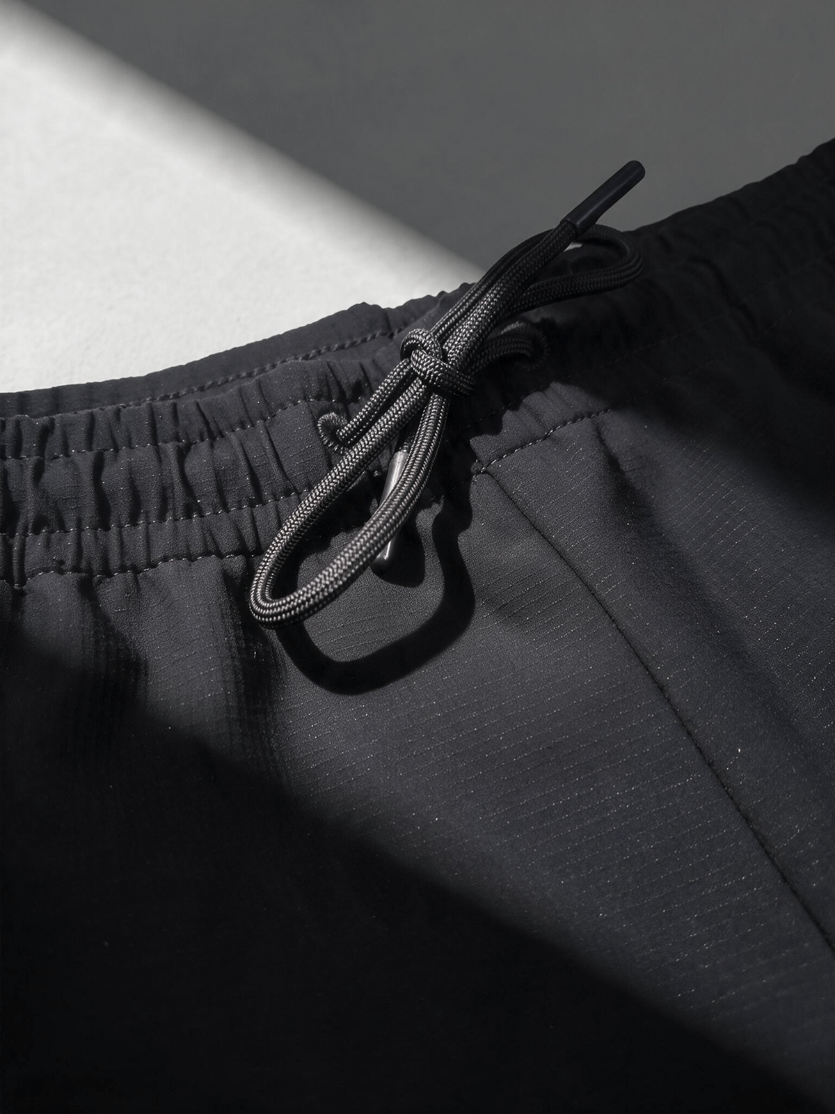 MOVEMENT PANTS Noir gaufré