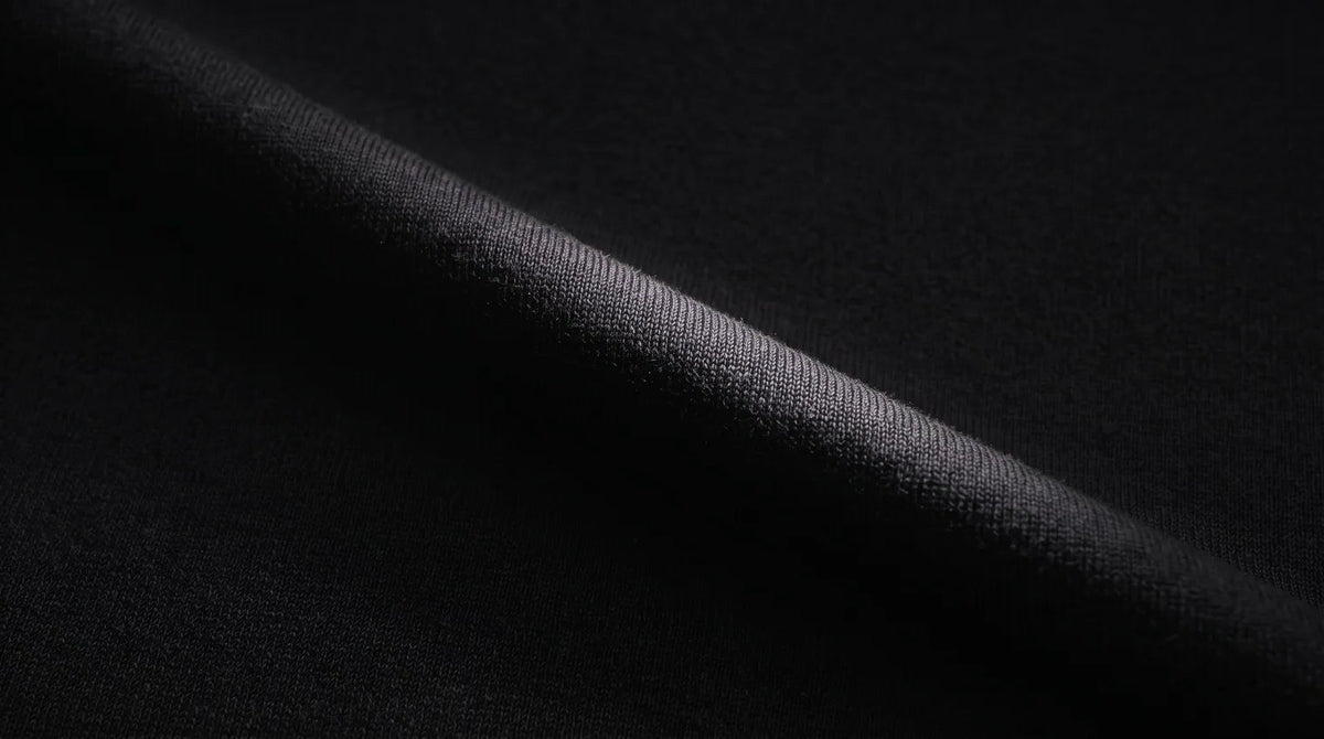 Black Performance Merino jersey drape, backlit